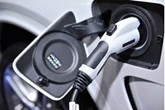 Electric vehicle charger plugged into car