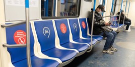 Passenger wearing mask on metro train