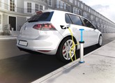 A CGI of a white Volkswagen Golf being charged at a kerbside charging point