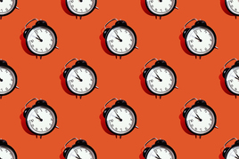 Alarm clocks on red background