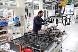 Man working on battery production in a factory