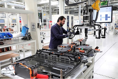 Man working on battery production in a factory