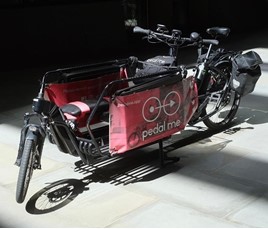 Red and black Pedal Me cargo bike 