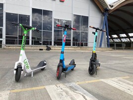 Row of three e-scooters