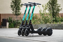 Row of e-scooters parked on a street