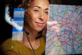 Woman looking at a map on screen
