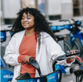 Woman with a shared bike
